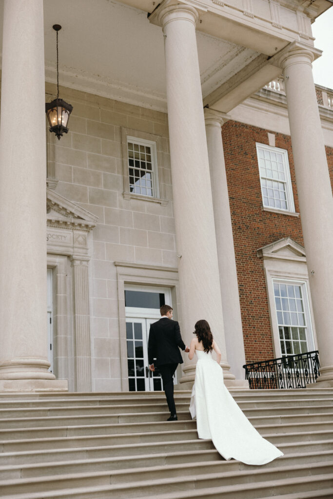 Bride & Groom walking up Chicago History Museum back steps 